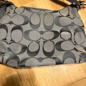 Coach SoHo Signature canvas shoulder bag with two tags.